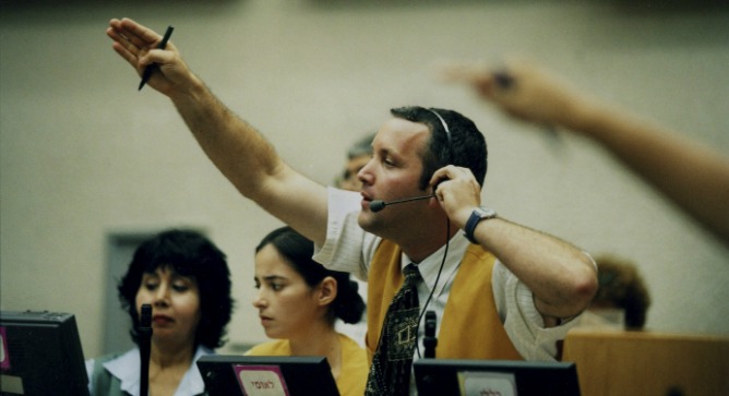 A broker at the Tel Aviv Stock Exchange. Photo by Flash90.