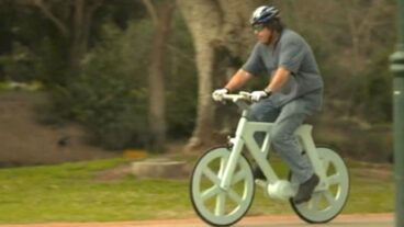 Izhar Gafni goes for a spin on his cardboard bike.