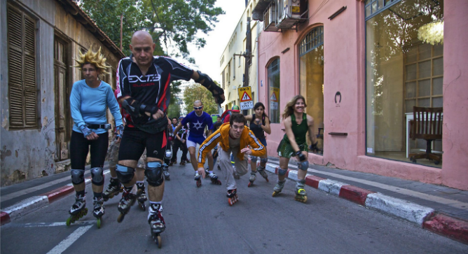 Rollerbladers ride through the streets of Tel Aviv on one of their weekly jaunts. Photo by Flash90.