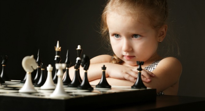 Previous research suggests that playing chess will improve reading performance and school grades in children. Photo via www.Shutterstock.com