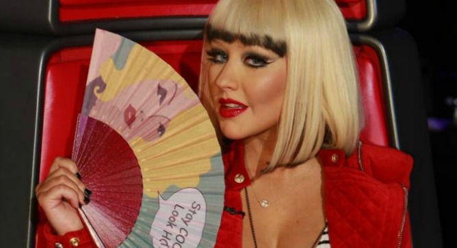 Christina Aguilera loves Fancy Hand Fans. Photo courtesy of Christina Aguilera's FB page by Trae Patton/NBC