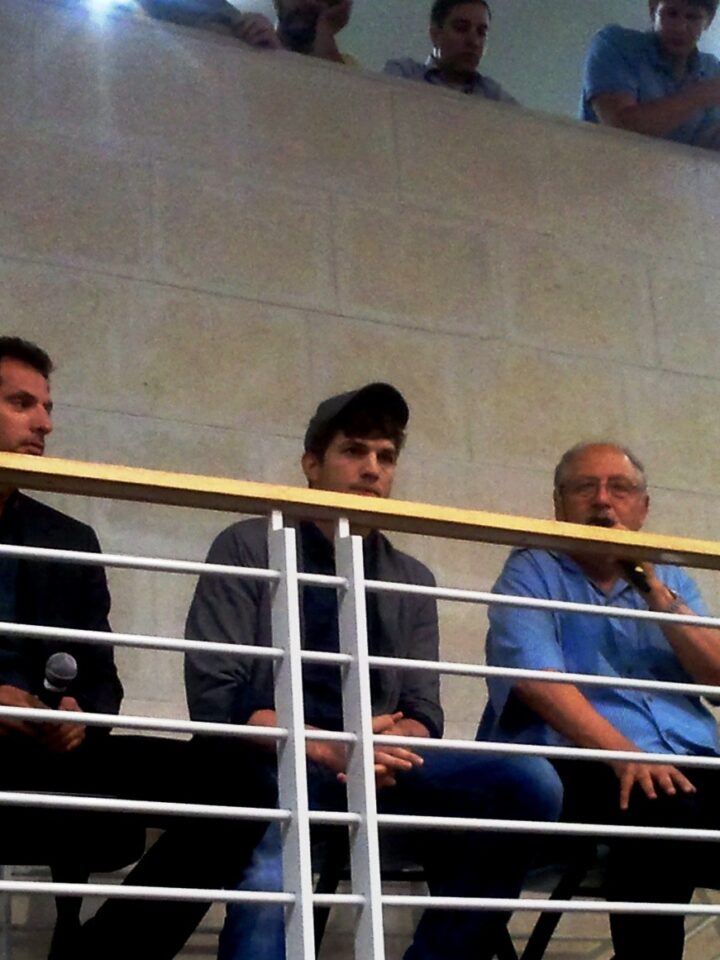 Guy Oseary, Ashton Kutcher and Yossi Vardi address GarageGeeks Israel. (Photo: David Brinn)