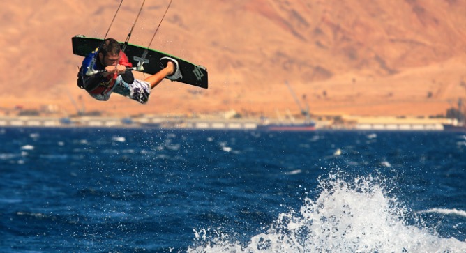 Kitesurfing in Eilat. Photo by Rostislav Glinsky/Shutterstock.com.
