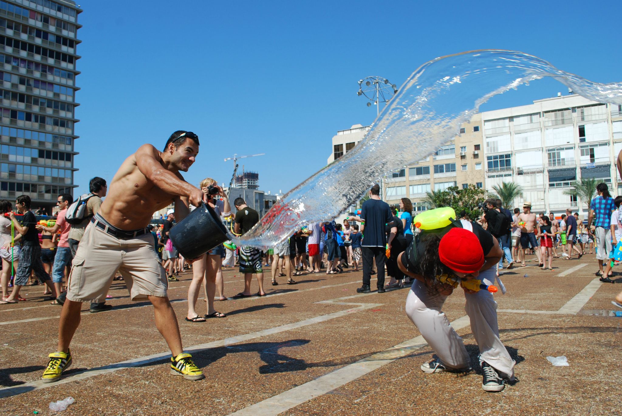 Splashing fun at Rabin Square in Tel Aviv. (photo courtesy of Water War TLV's Facebook page)