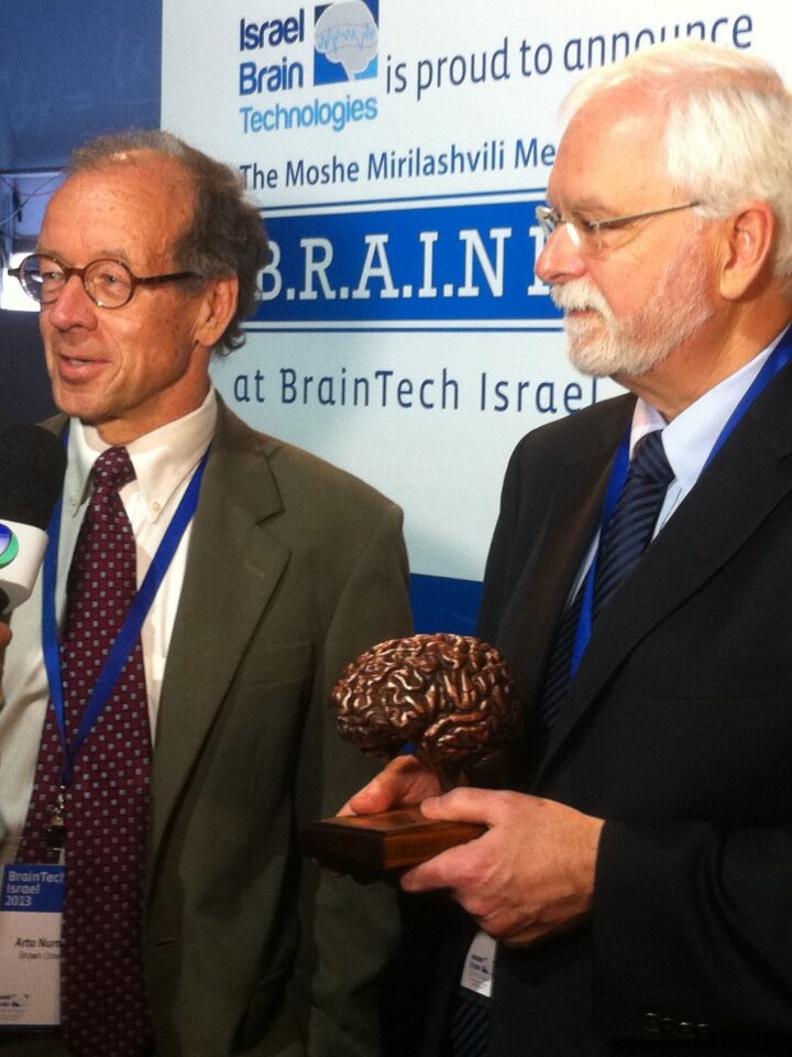 Brown University's Prof. Arto Nurmikko (left) and Dr. John Donoghue accept the $1 million B.R.A.I.N prize in Tel Aviv. (Photo: Karin Kloosterman)