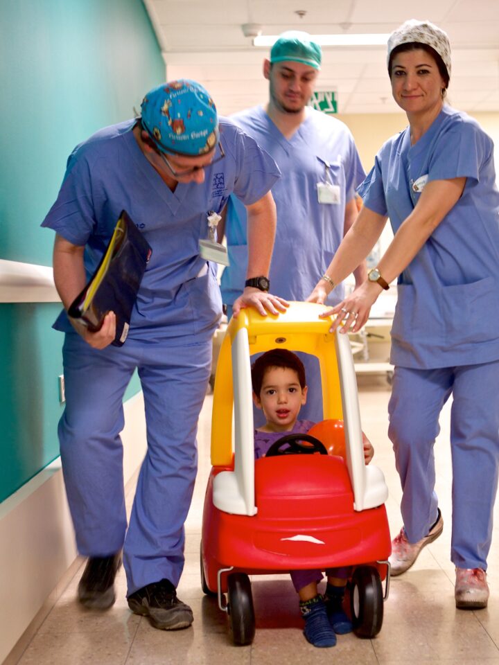 Three-year-old Shachaf Rosenbloom was one of the first young patients at the Schneider Children's Medical Center to try out the new pedal car transfer service.  (Courtesy)