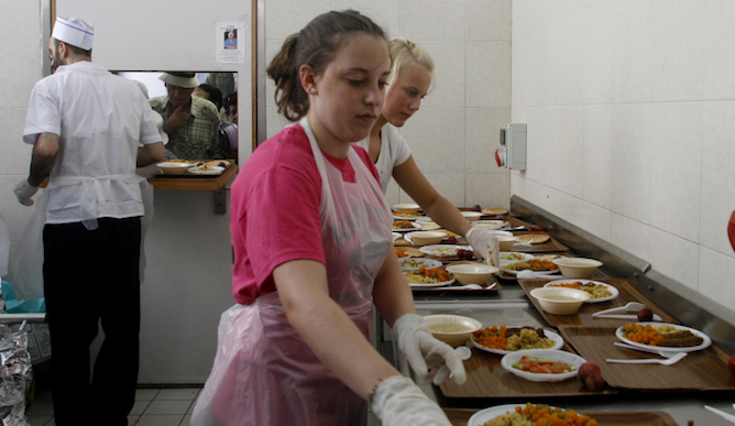 Volunteers at a soup kitchen in Israel. Photo by Lara Savage/Flash 90