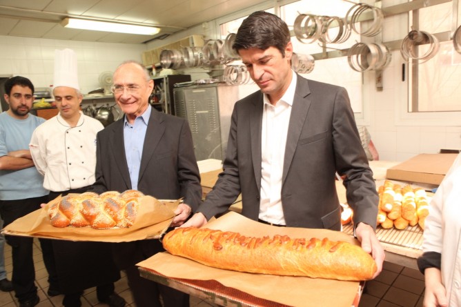 Tourism Minister Dr. Uzi Landau and French Ambassador to Israel Patrick Maisonnave show off an Israeli inspired baguette and a French challah at the So Good So Tasty festival. (Chen Ghalili)