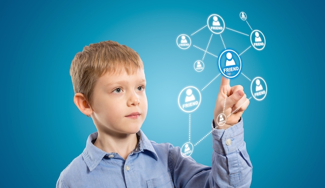 (kids social media) Connecting kids safely to social media. Image via Shutterstock.com