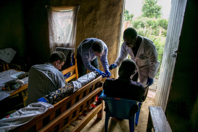 Dr. Lobel collecting samples from Ebola survivors in Uganda.