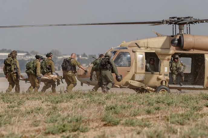 An injured Israeli soldier is evacuated by helicopter from near the Israeli border with Gaza Strip on July 21, following heavy fighting. Photo by Flash90.