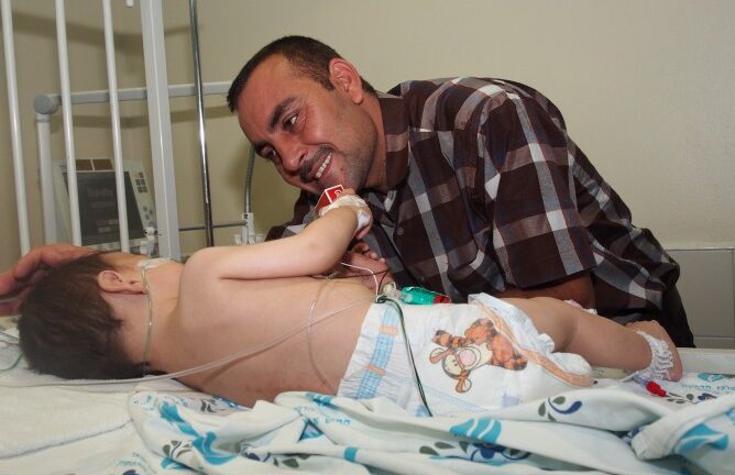 Wisam and his dad at Wolfson Medical Center.
