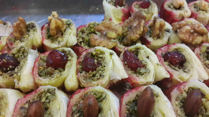 Nuts and dates are stuffed into savory pastries. Photo by Adnan Kvishi