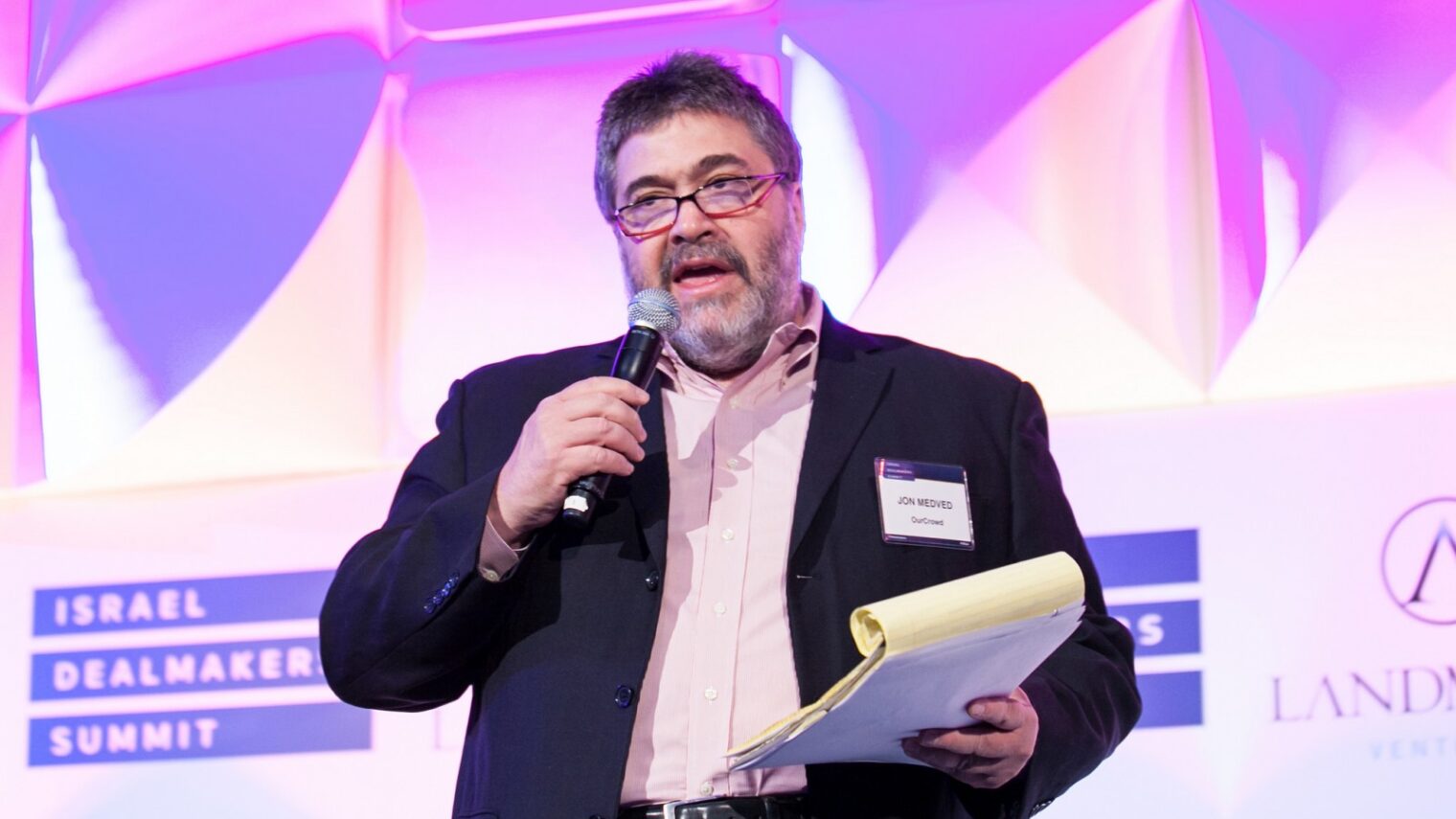 Jon Medved, founder of OurCrowd, speaking at the Israel Dealmakers Summit in New York in March 2014. Photo courtesy.