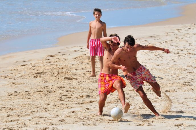 Join a pickup game at the beach. Image via Shutterstock.com