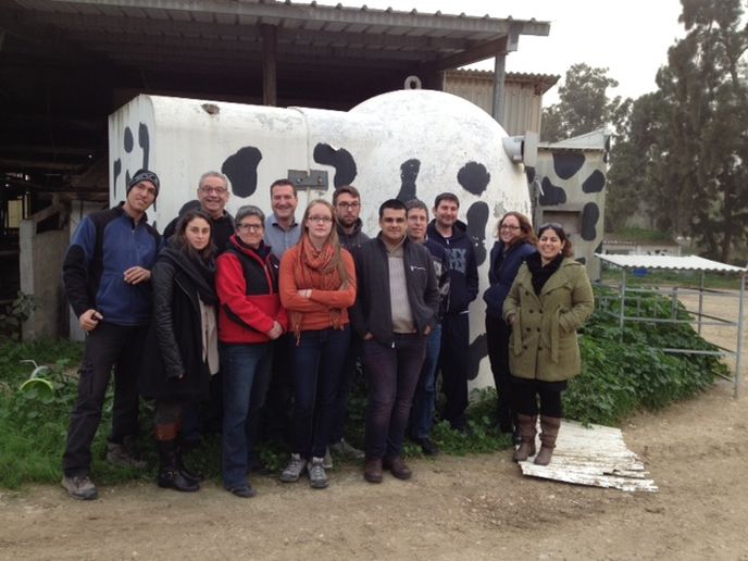SUNY-New Paltz and Ben-Gurion University graduate students at Kibbutz Saâ€™ad, near the Gaza Strip, where the bomb shelter near the cowshed is painted in a cow theme.