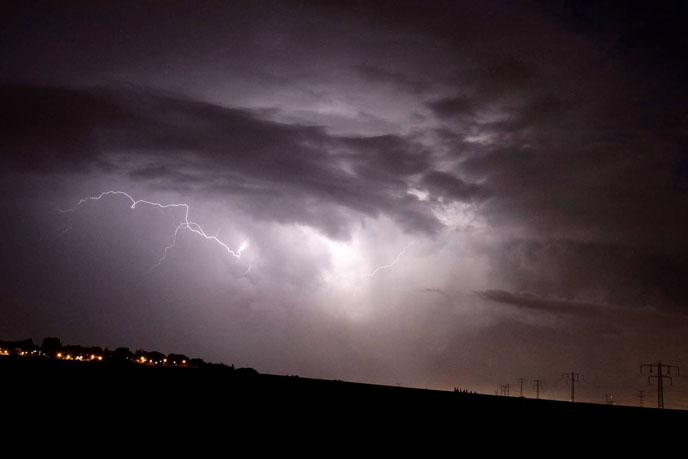 A thunder and lightning storm over Nitzan, in the south of Israel. (Photo by Edi Israel/Flash90)