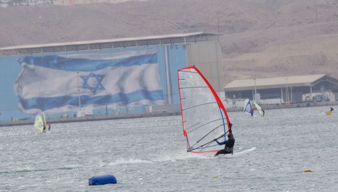 Wind surfers in Eilat enjoy a thrilling ride on the Red Sea.