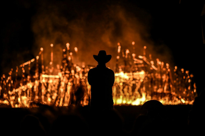 Watching the statues burn at the Midburn Festival. Photo by Ben Kelmer/Flash90.