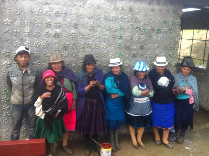 Members of the Punta Hacienda community next to the new medical clinic they built out of recycled bottles. (photo: MASHAV)