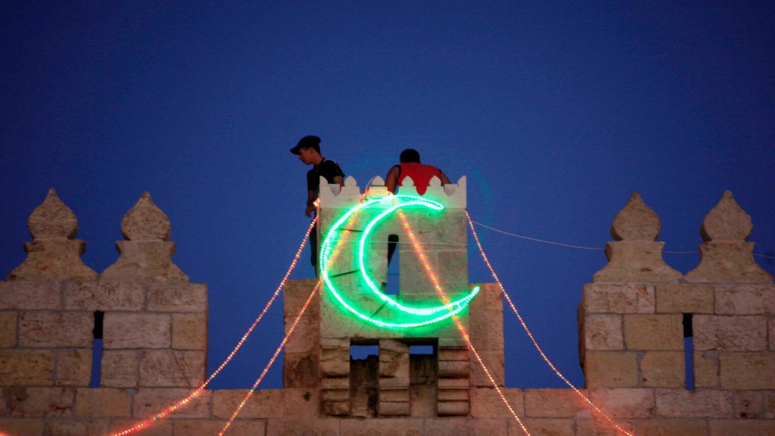 Hanging lights for Ramadan in Jerusalem. Photo by Sliman Khader/FLASH90