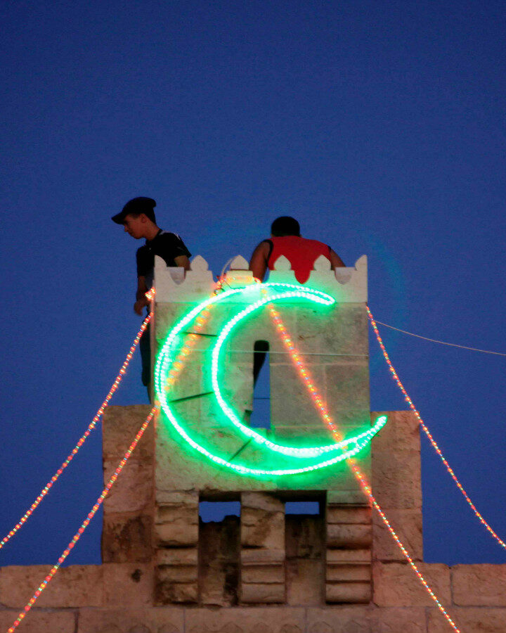 Hanging lights for Ramadan in Jerusalem. Photo by Sliman Khader/FLASH90