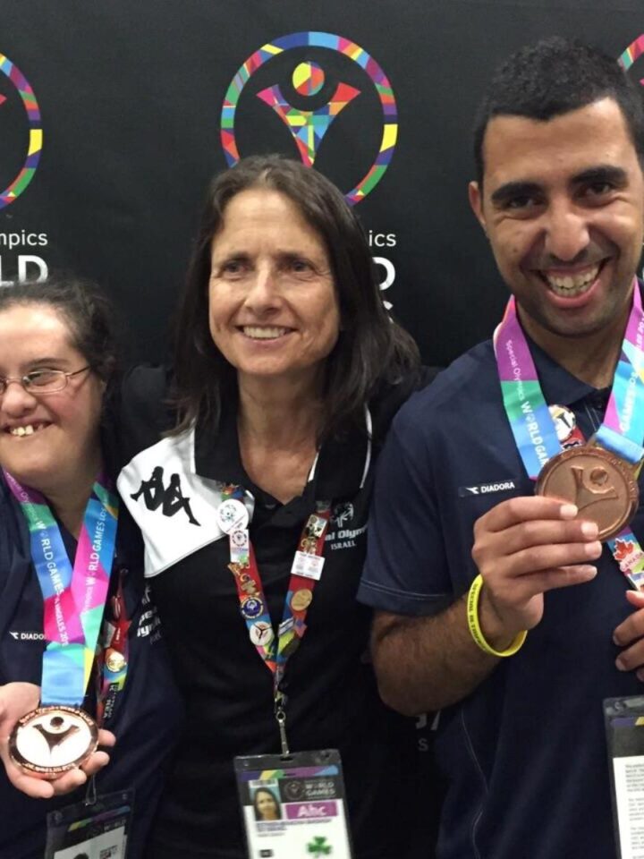 Israeli Special Olympics medalists rejoicing with their coach. Photo via Facebook