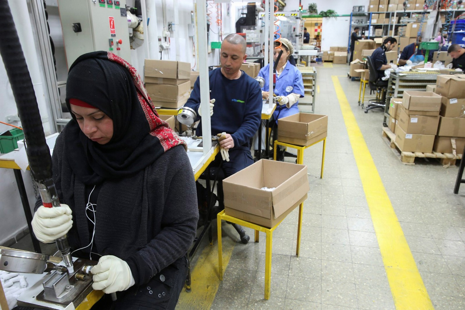 Palestinians and Jews  working together at the former SodaStream factory in Maale Adumim. Photo by Nati Shohat/Flash90