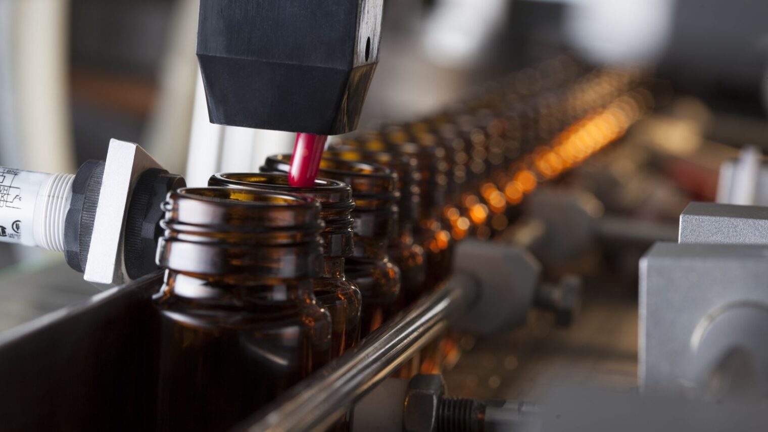 The Induction Integrity Verification System checks every bottle after it’s sealed. Image via Shutterstock.com