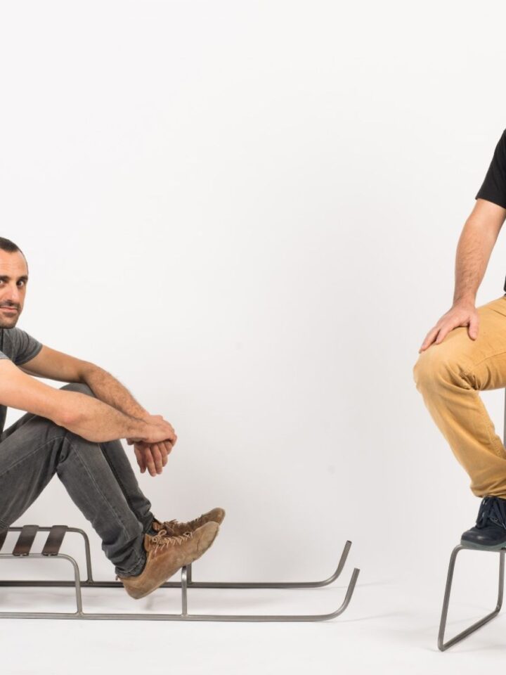 Neil Nenner, left, and Lior Yamin of SAGA TLV gallery in Jaffa trying out Nenner’s minimalist seating designs. Photo by Shachar Fleischmann