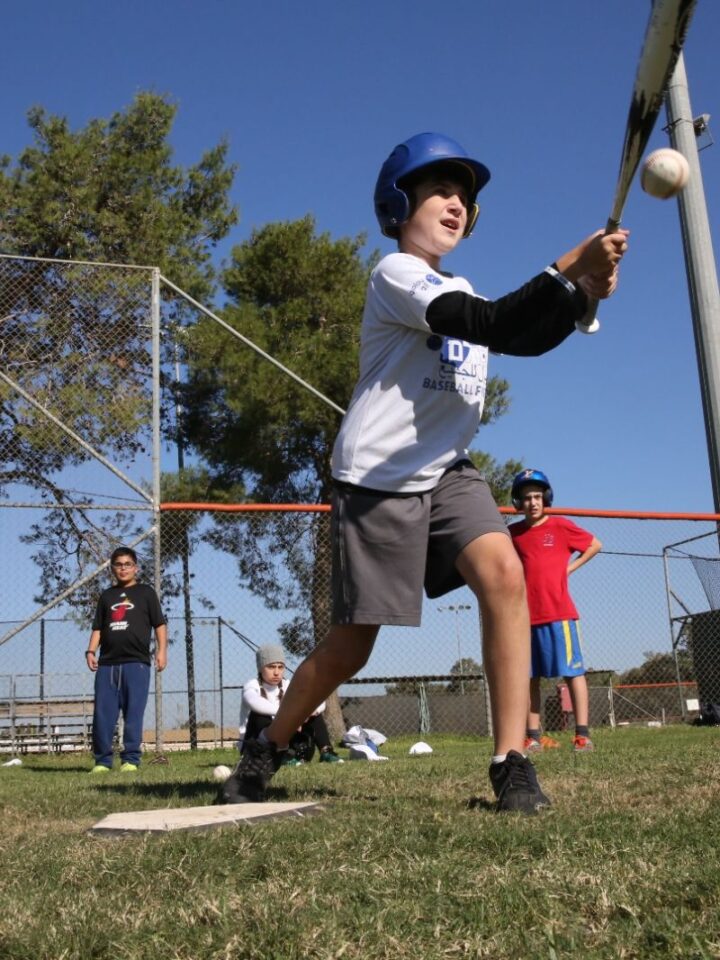 Baseball for All brings 15 Israeli Arab and 15 Israeli Jewish kids together to bat, pitch and run bases. Photo by Yossi Zamir/JNF