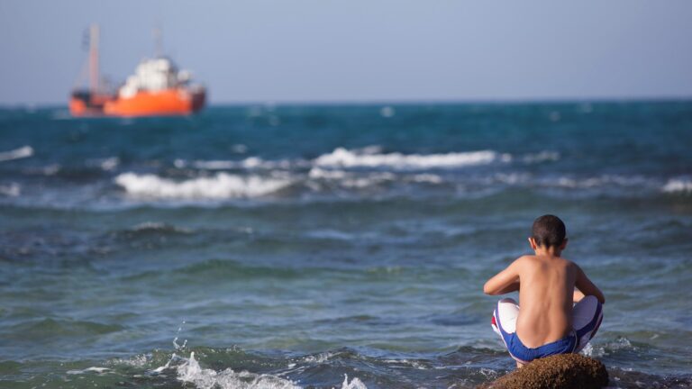 An Israeli boy enjoying a hot day at Palmahim Beach. Photo by Yonatan SindelFLASH90