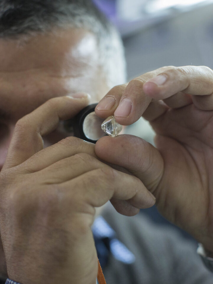 A man examines a diamond during the International Diamond Week at the Israel Diamond Exchange center in Ramat Gan. Photo by Yonatan Sindel/Flash90