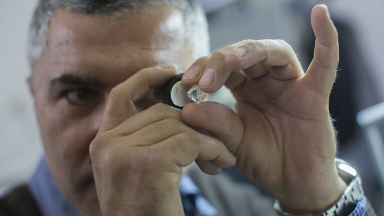 A man examines a diamond during the International Diamond Week at the Israel Diamond Exchange center in Ramat Gan. Photo by Yonatan Sindel/Flash90