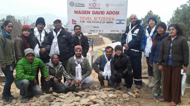 Tevel b’Tzedek and Magen David Adom provided building materials and food to earthquake victims in Nepal. Photo via Facebook