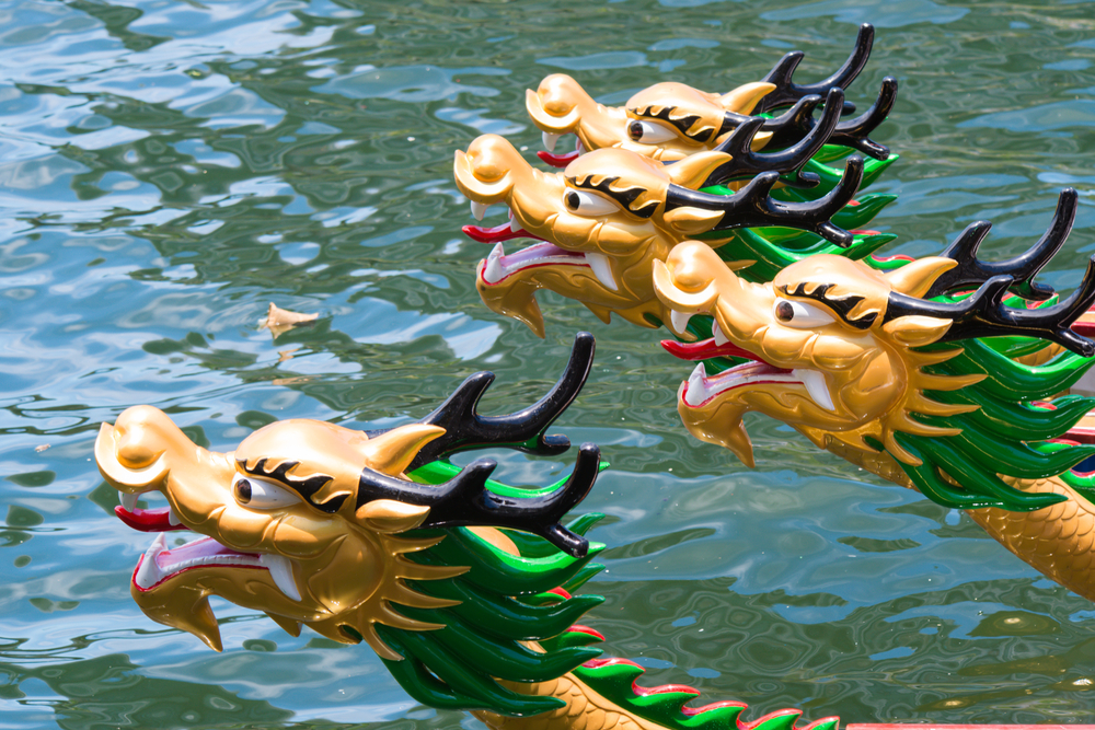 Dragon Boats sport a dragon's head and tail. Photo via Shutterstock