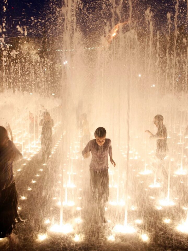 Children play in a fountain in Teddy Park opposite the Old City walls in Jerusalem. Photo by Zuzana Janku/Flash90