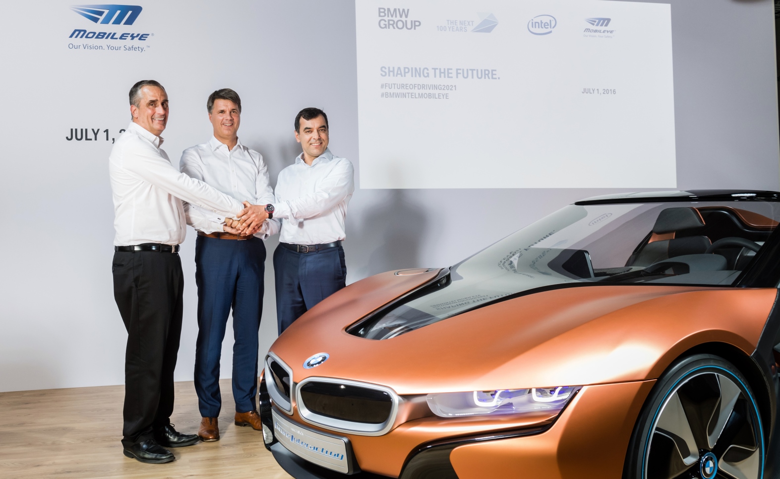 From left, Intel CEO Brian Krzanich, Chairman of the Board of Management of BMW AG Harald KrÃ¼ger and Mobileye Cofounder, Chairman and CTO Prof. Amnon Shashua at a news conference in Munich where they announced their partnership. Photo courtesy of BMW Group