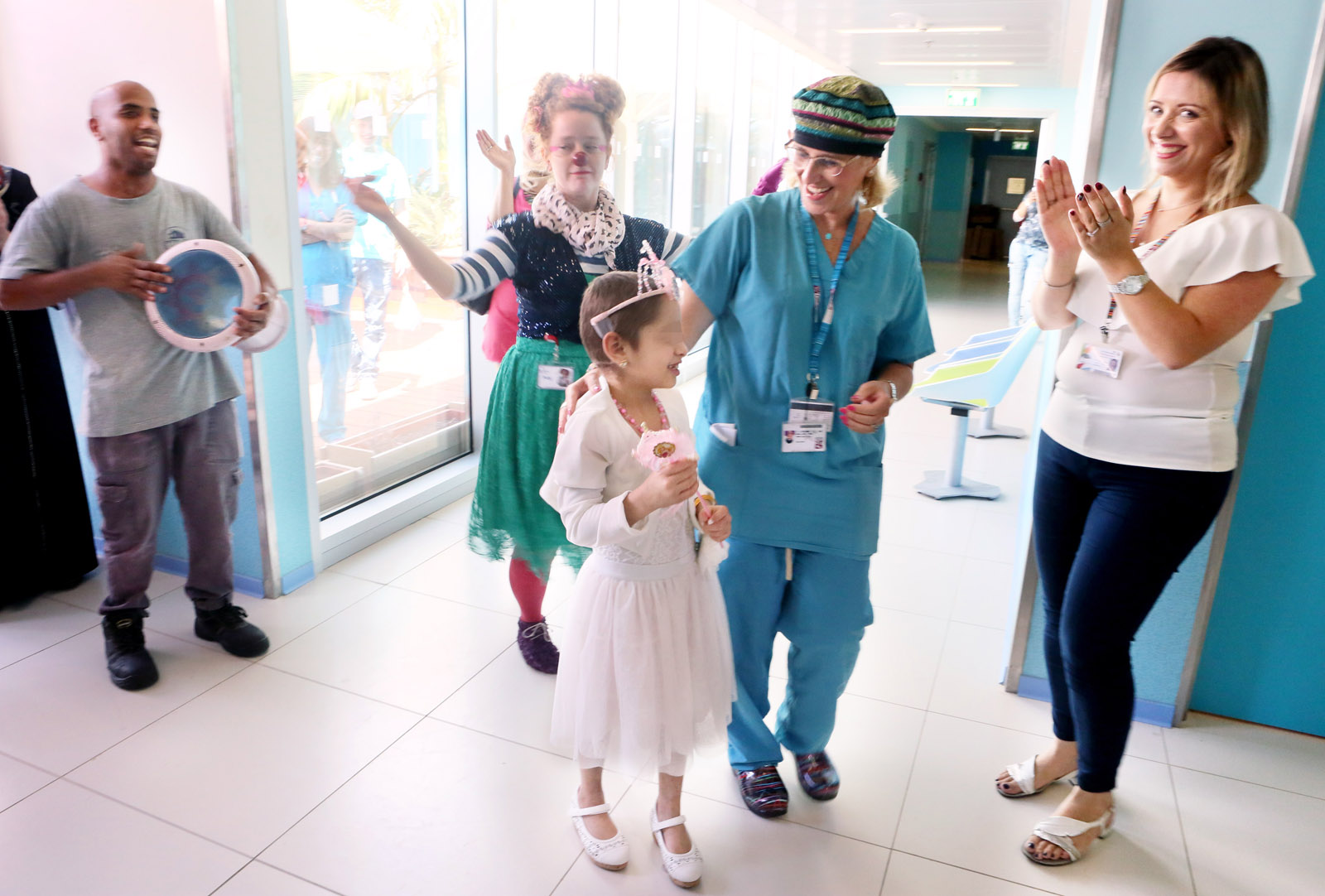 A Syrian girl says goodbye to her Israeli caregivers at Rambam Health Care Campus. Photo courtesy