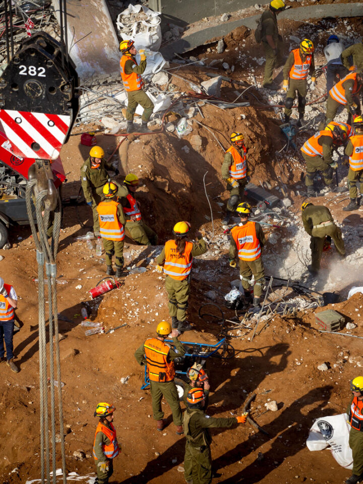 Rescue workers try to find survivors under the collapsed parking garage in Tel Aviv.  Photo by Miriam Alster FLASH90