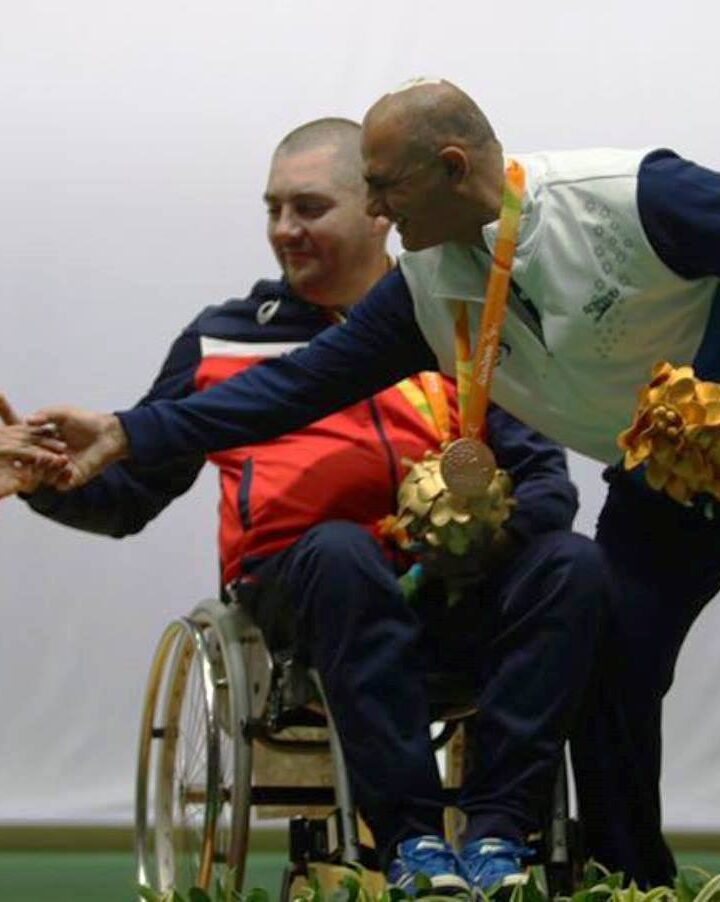 Bronze medalist Doron Shaziri of Israel extending a hand to silver medalist Abdullah Sultan al-Aryani of the United Arab Emirates. Photo by Keren Isaacson/Israel Paralympic Committee