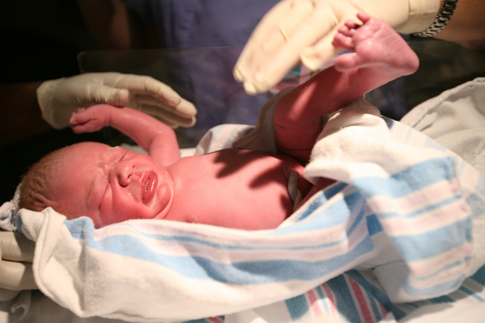 Spontaneous delivery or induced delivery? A healthy baby is what matters most. Photo via Shutterstock