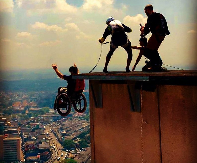 Lonnie Bissonnette uses a wheelchair fitted with SoftWheels to perform BASE jumps around the world. Photos via facebook.com/TheLonnieBissonnette