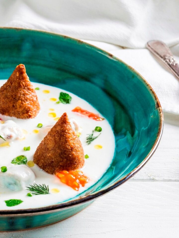 Al-basha Oasakru – a Syrian dish, meaning the pasha and his soldiers. Shishbarak dumplings (the soldiers) and a bulgur wheat kibbeh (the pasha) are cooked in yogurt. Photo by Asaf Ambram
