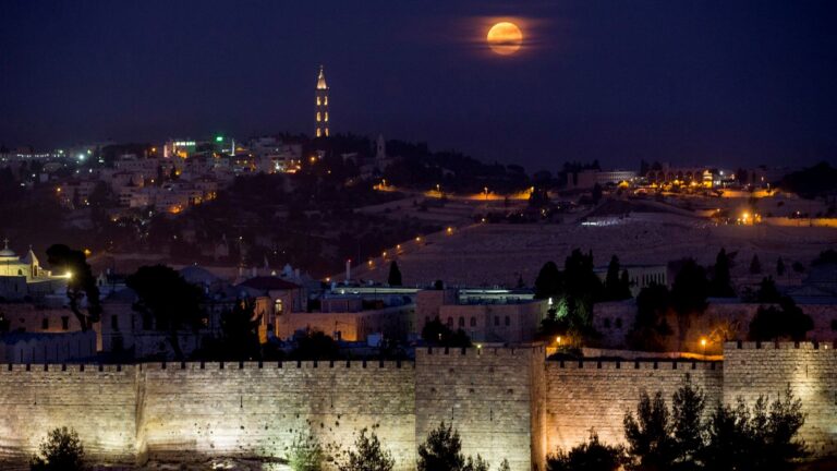 The supermoon rises over Jerusalem's Old City walls on November 14, 2016. Photo by Yonatan Sindel/Flash90