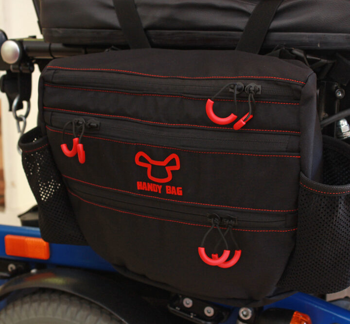 Handy Bag for manual wheelchairs consists of a carrier and a removable bag with two quick-access pockets. Photo: courtesy