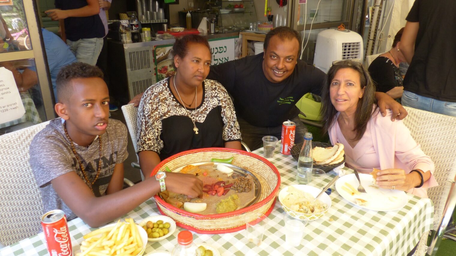 Lori Bacher with Nobel and his mother and restaurateur Asi Zaoda at Zaoda’s Ra’anana eatery. Photo by Doron Bacher