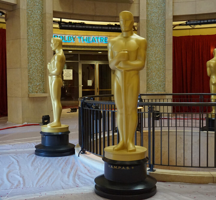Large golden Oscar statues guard the entrance to the Dolby Theater where the Academy Awards are held. Photo via Shutterstock.com