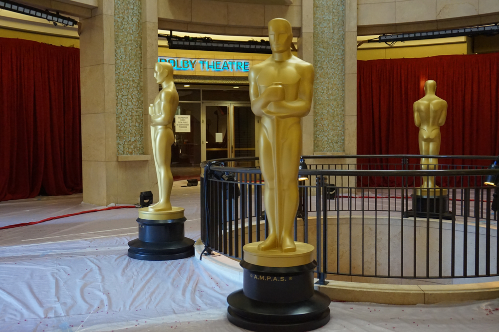 Large golden Oscar statues guard the entrance to the Dolby Theater where the Academy Awards are held. Photo via Shutterstock.com