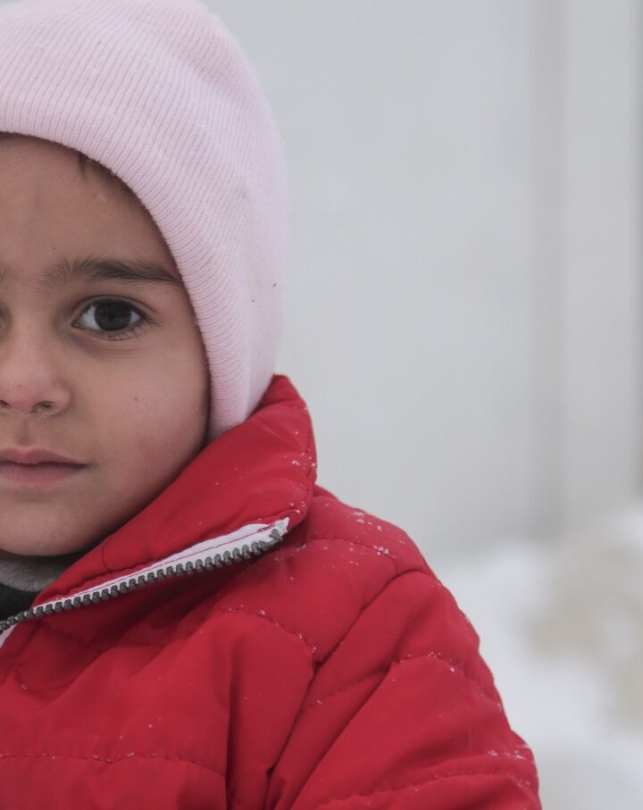 A Syrian refugee child in Greece, January 2017. Photo by Nicolas Economou/Shutterstock